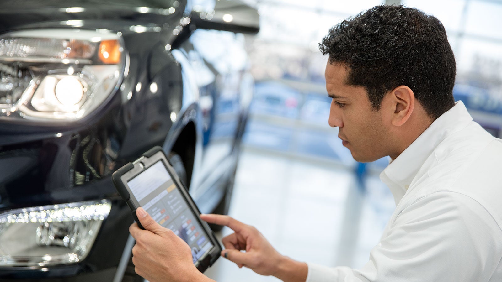 Technician performing diagnostics on a Chevrolet vehicle