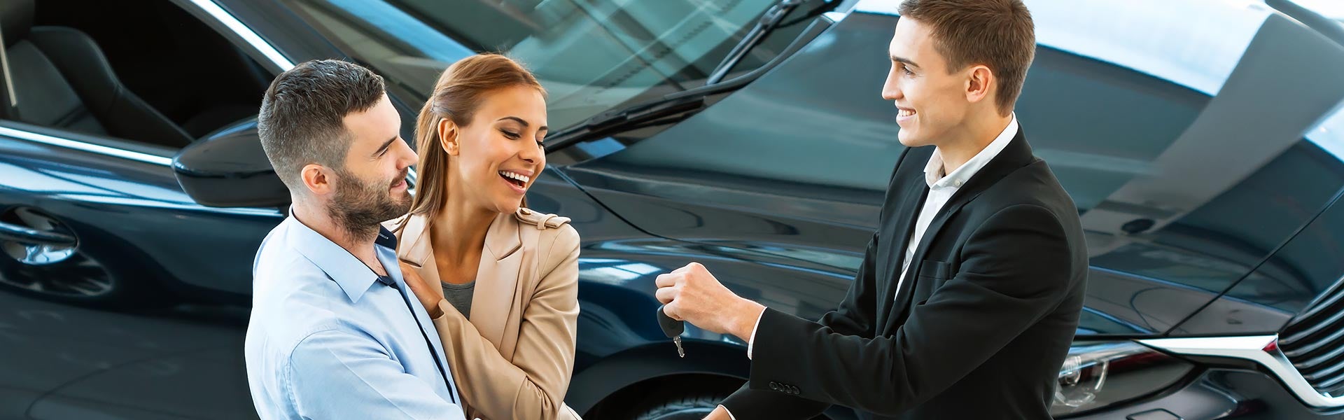 Happy customer getting keys to their new vehicle